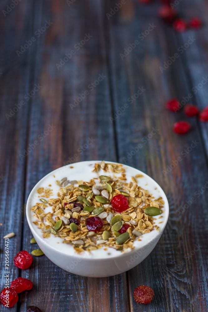 Granola with yoghurt, dried berries and pumpkin seeds Granola with yoghurt, dried berries and pumpkin seeds