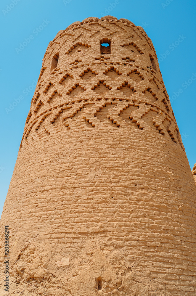 Houses of abandoned mud brick village of Kharanaq in Iran.