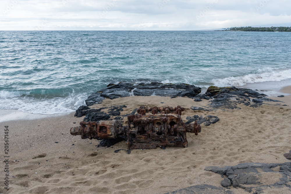 An old boat's diesel engine abandoned at the beach, Big Island, Hawaii An old boat's diesel engine abandoned at the beach, Big Island, Hawaii