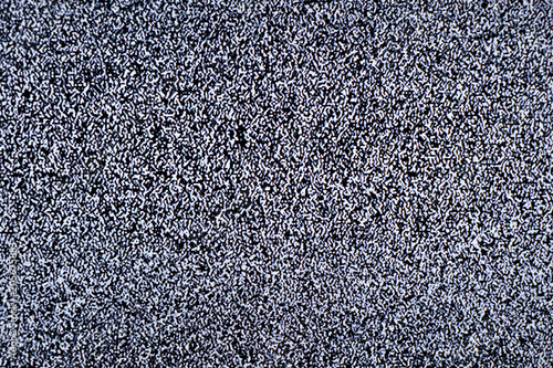 Television screen with static noise caused by bad signal reception or no signal. Abstract background. photo