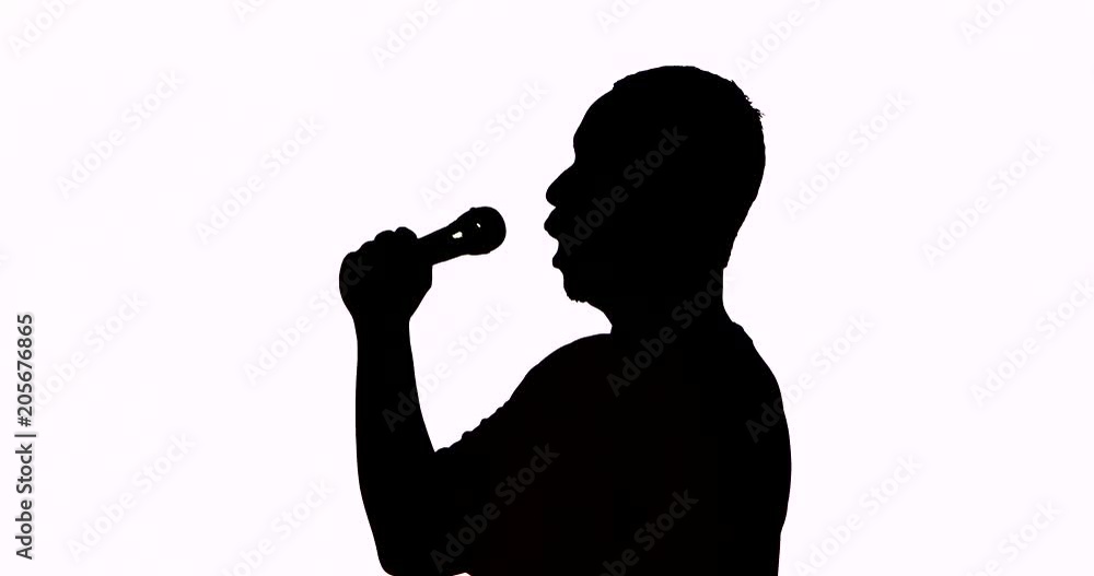 Silhouette of a male singer singing a song with a microphone and classical gesture in the studio, isolated on white background. Shot in 4k resolution Silhouette of a male singer singing a song with a microphone and classical gesture in the studio, isolated on white background. Shot in 4k resolution