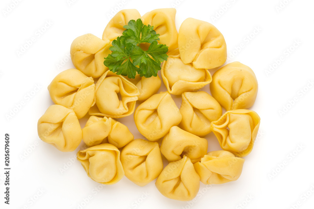 Raw homemade pasta,tortellini with herbs. Raw homemade pasta,tortellini with herbs.