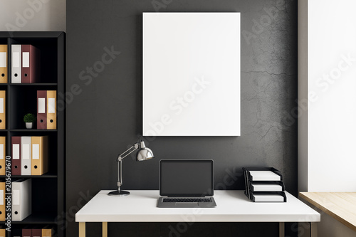 Contemporary interior with laptop and billboard