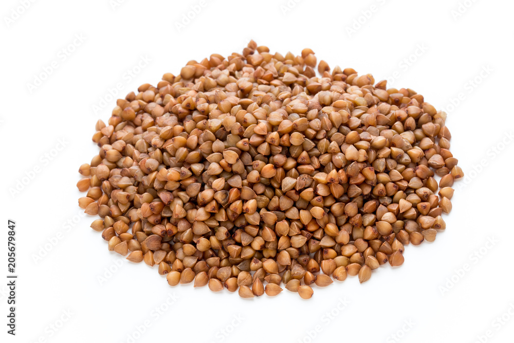 Buckwheat grains isolated on the white background. Buckwheat grains isolated on the white background.