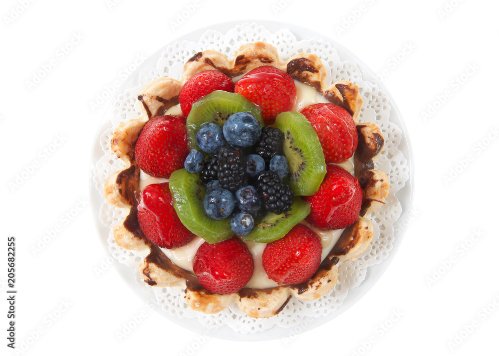 Top view Fresh summer fruit tart with strawberries, kiwi, blueberries, boysenberries on a white doily on plate isolated on white background Top view Fresh summer fruit tart with strawberries, kiwi, blueberries, boysenberries on a white doily on plate isolated on white background