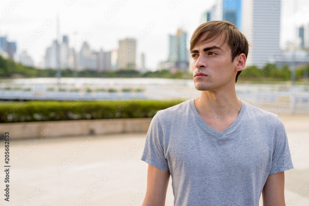 Young handsome man relaxing at the park Young handsome man relaxing at the park