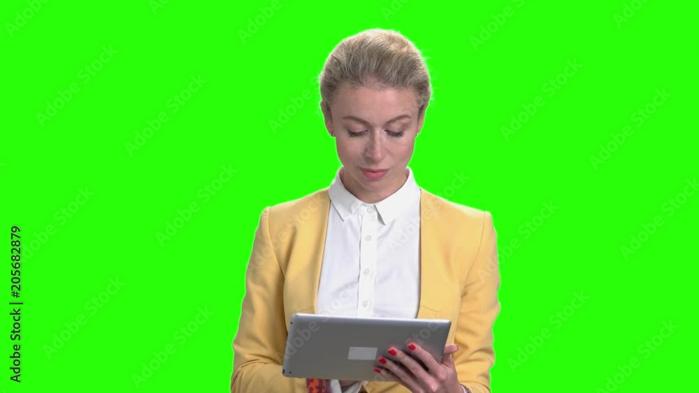Business woman with pc tablet on chroma key background. Young pretty female typing on digital tablet on Alpha Channel background. Business woman with pc tablet on chroma key background. Young pretty female typing on digital tablet on Alpha Channel background.