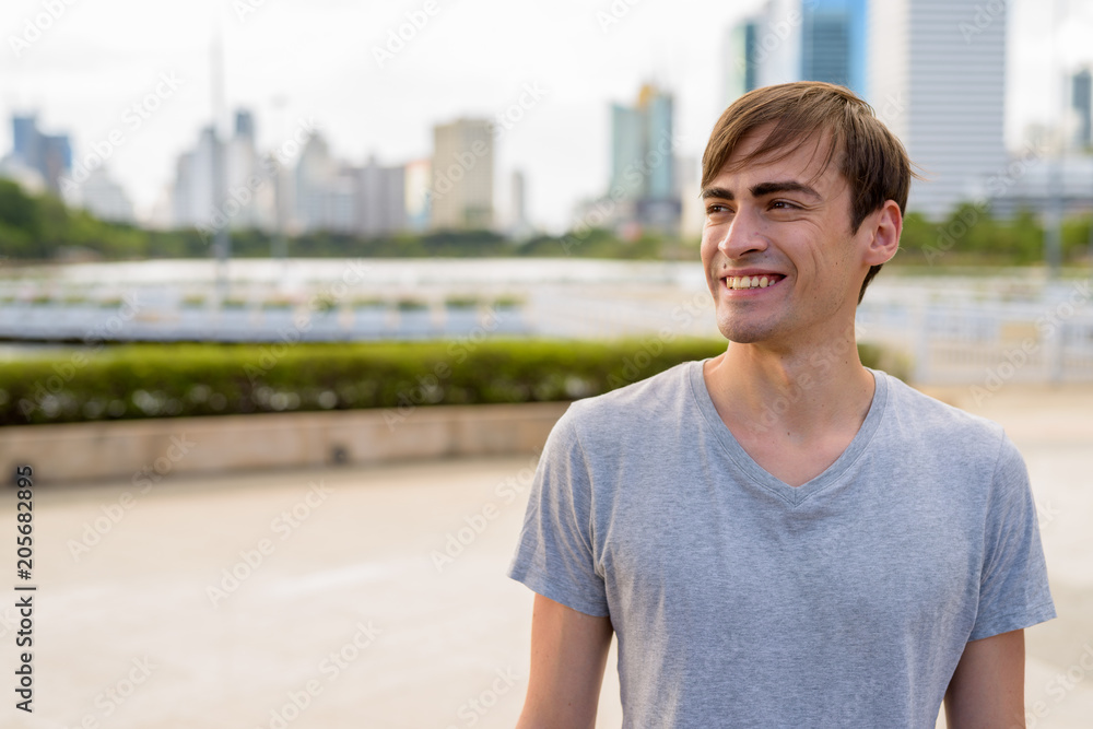 Young handsome man relaxing at the park Young handsome man relaxing at the park
