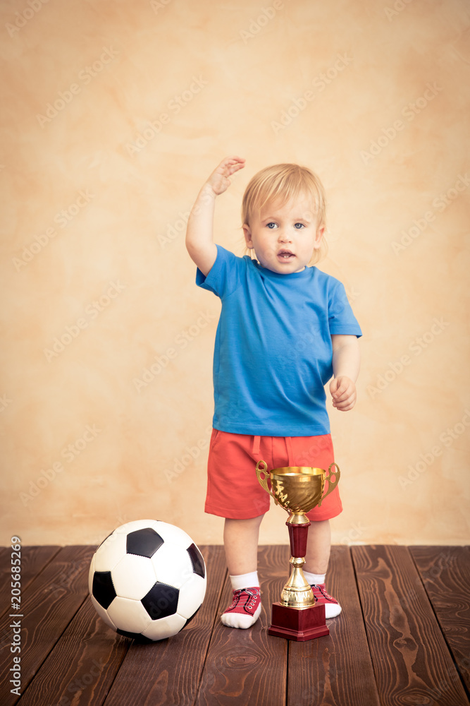 Child is pretending to be a soccer player Child is pretending to be a soccer player