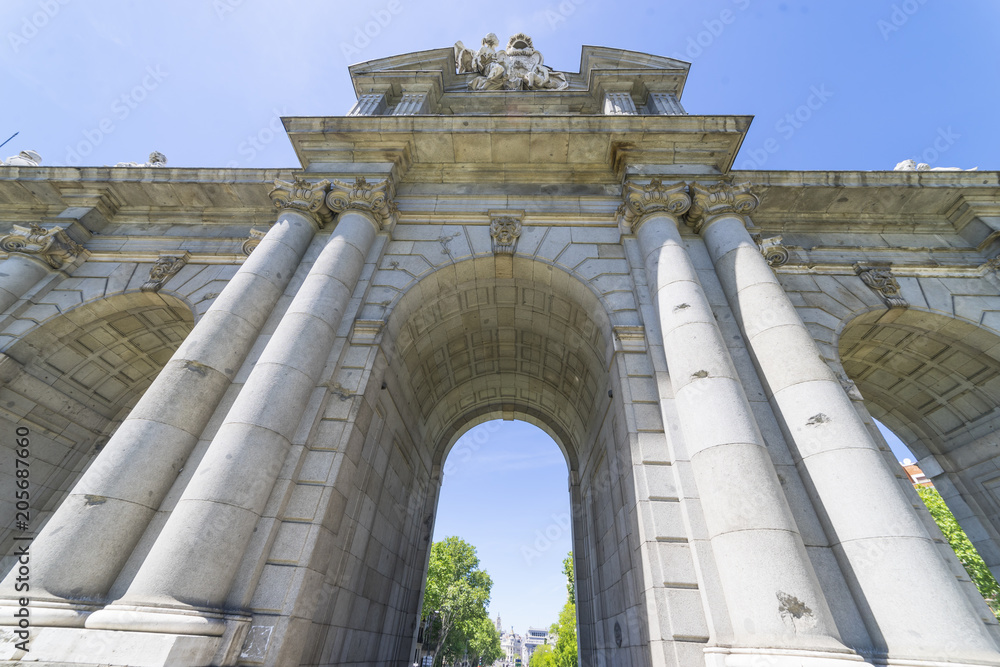 Fototapeta premium Puerta de Alcala is a one of the Madrid ancient doors of the city of Madrid, Spain. It was the entrance of people coming from France, Aragon, and Catalunia. It is a landmark of the city.