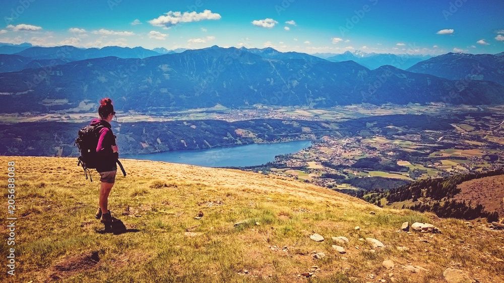 woman standing on the top of a mountain with wonderful view