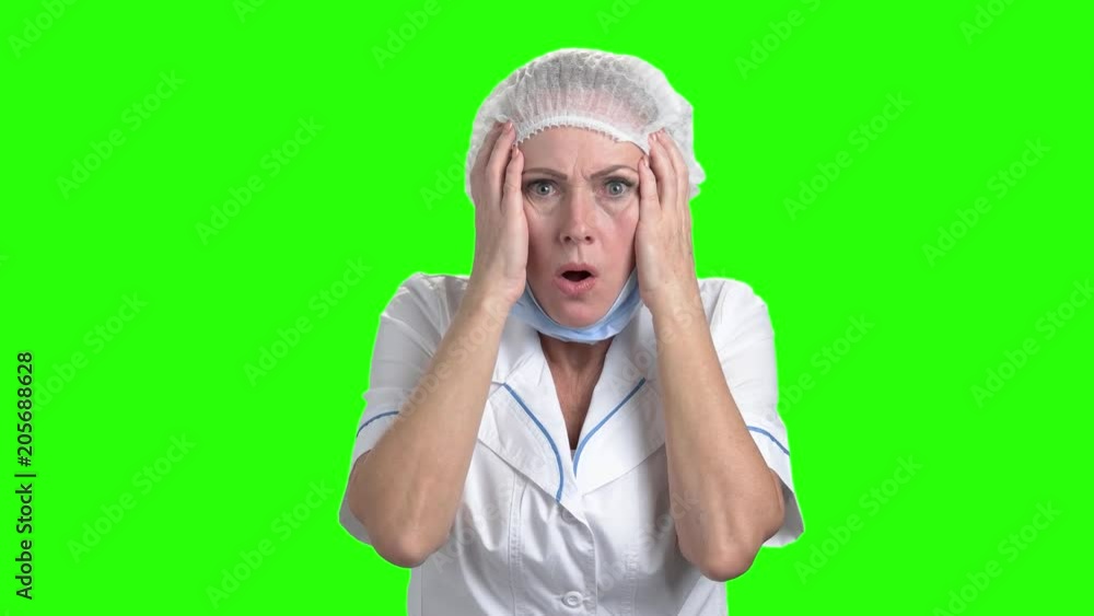 Shocked caucasian doctor on green screen. Scared and horrified female doctor on Alpha Channel background. Shocked caucasian doctor on green screen. Scared and horrified female doctor on Alpha Channel background.