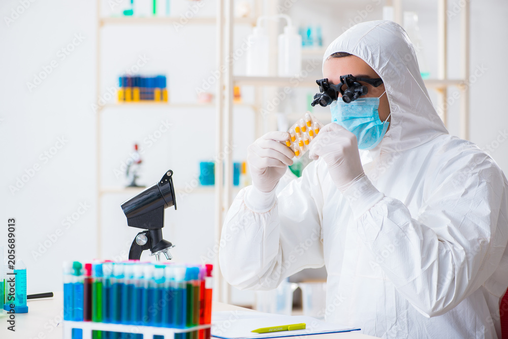 Drug synthesis concept with chemist working in research lab Drug synthesis concept with chemist working in research lab