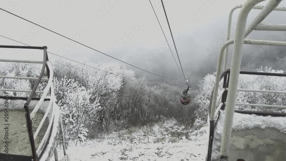The cabin of the cable car slowly rises to the upper station