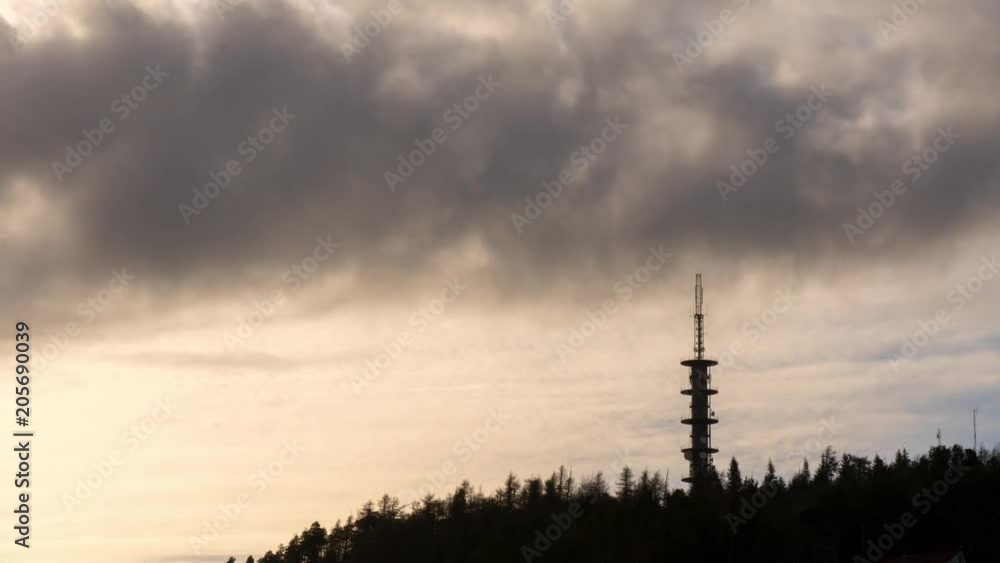 Fast moving clouds with antenna in the foreground. Fast moving clouds with antenna in the foreground.