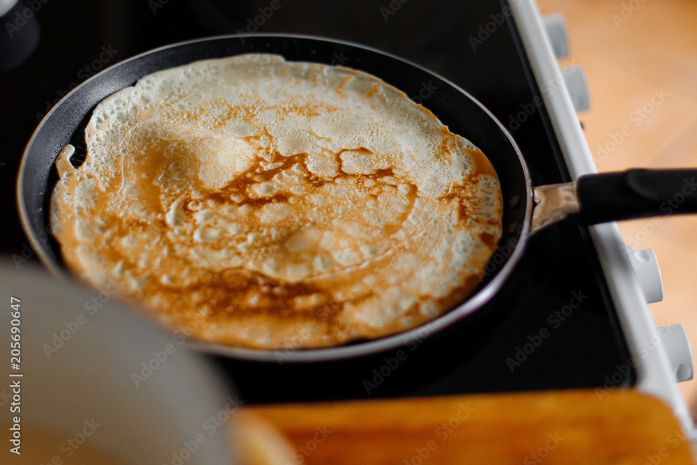 Fried pancake in a frying pan