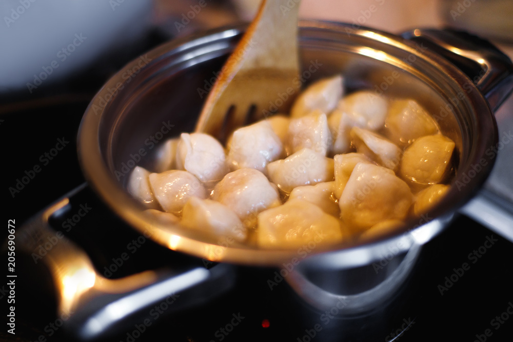 Cooking dumplings. Pot and boiling water, closeup. Cooking dumplings. Pot and boiling water, closeup.