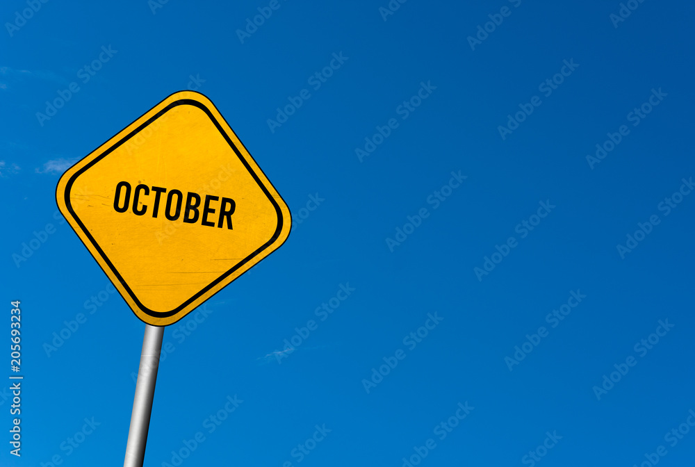October - yellow sign with blue sky October - yellow sign with blue sky