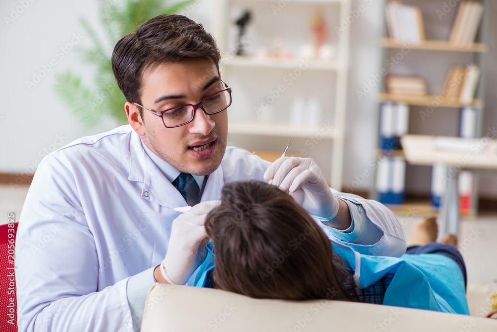 Patient visiting dentist for regular check-up and filling Patient visiting dentist for regular check-up and filling