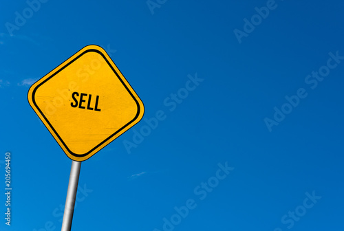 sell - yellow sign with blue sky © Bildgigant