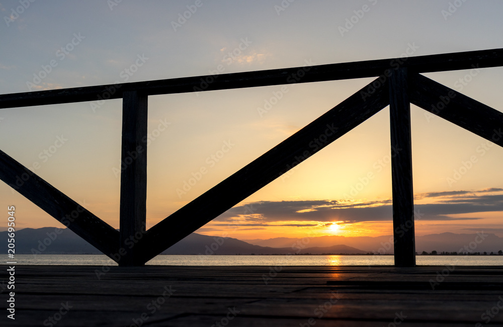sunset on a wooden footbridge