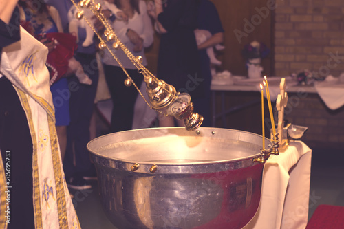 Fotografija christening bath and the altar at the orthodox church during christening