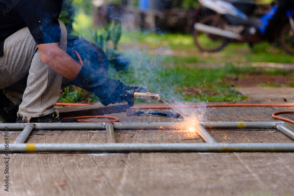 Welded steel pipe in the work by skilled technicians. Welded steel pipe in the work by skilled technicians.