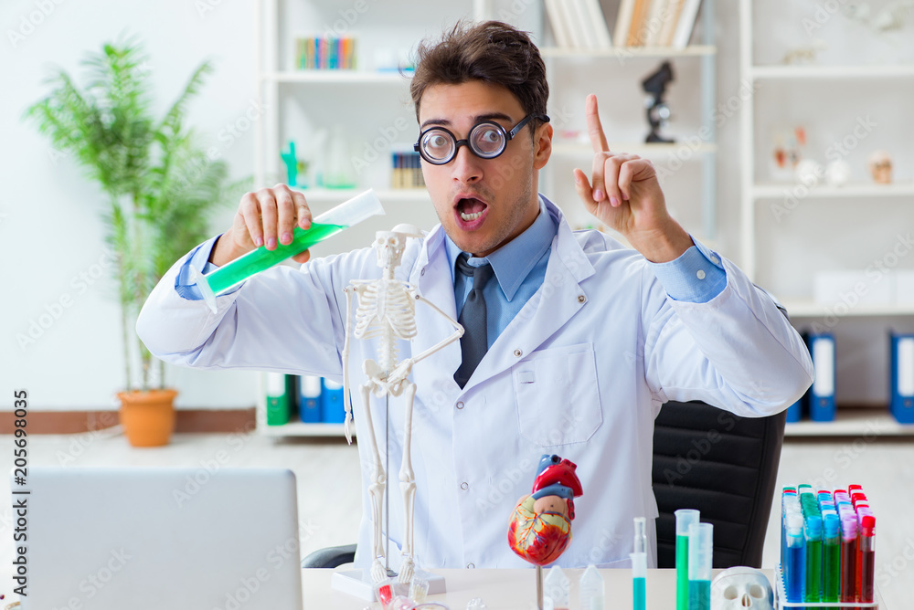 Funny doctor having fun in hospital lab Funny doctor having fun in hospital lab
