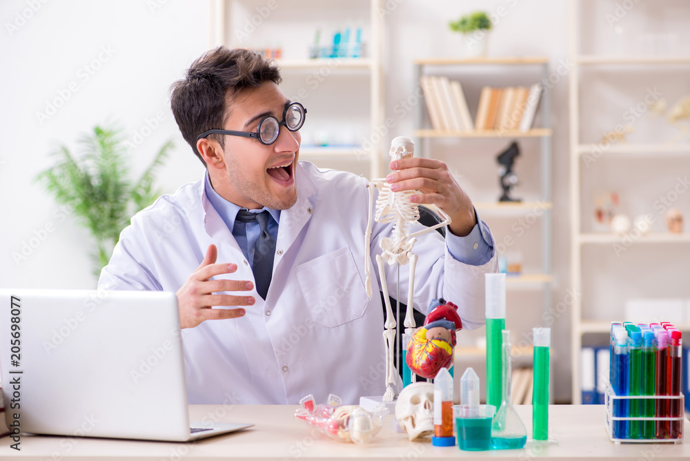 Funny doctor having fun in hospital lab Funny doctor having fun in hospital lab