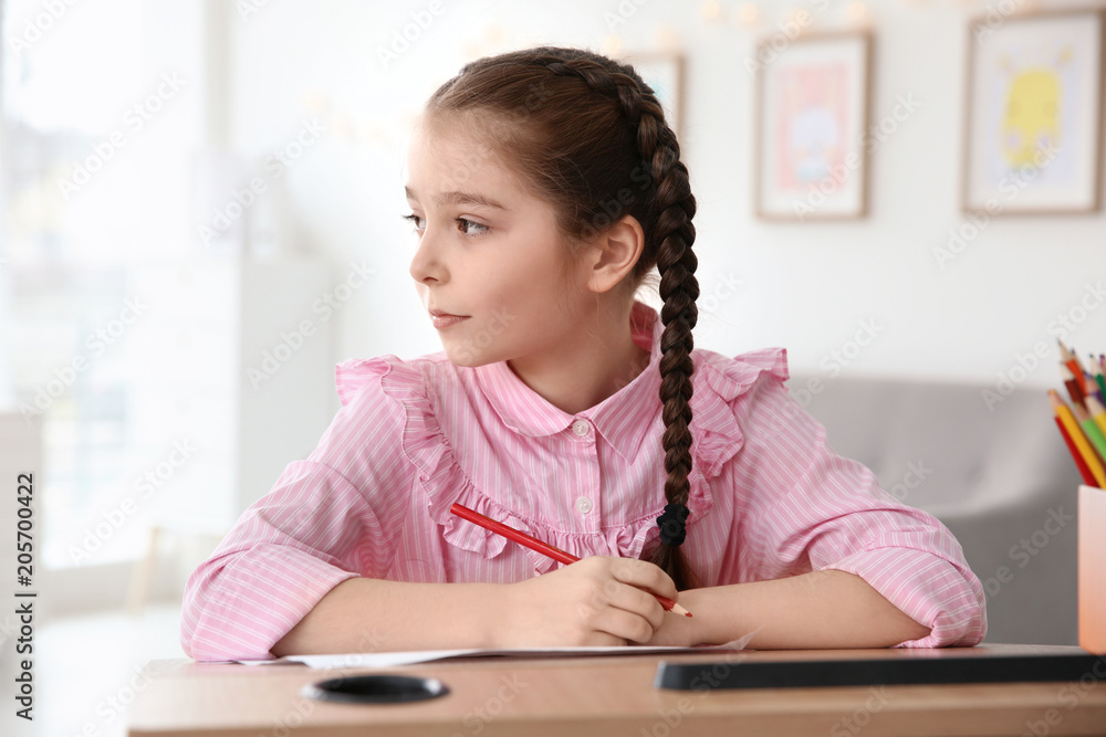 Little girl with autistic disorder drawing at home Little girl with autistic disorder drawing at home