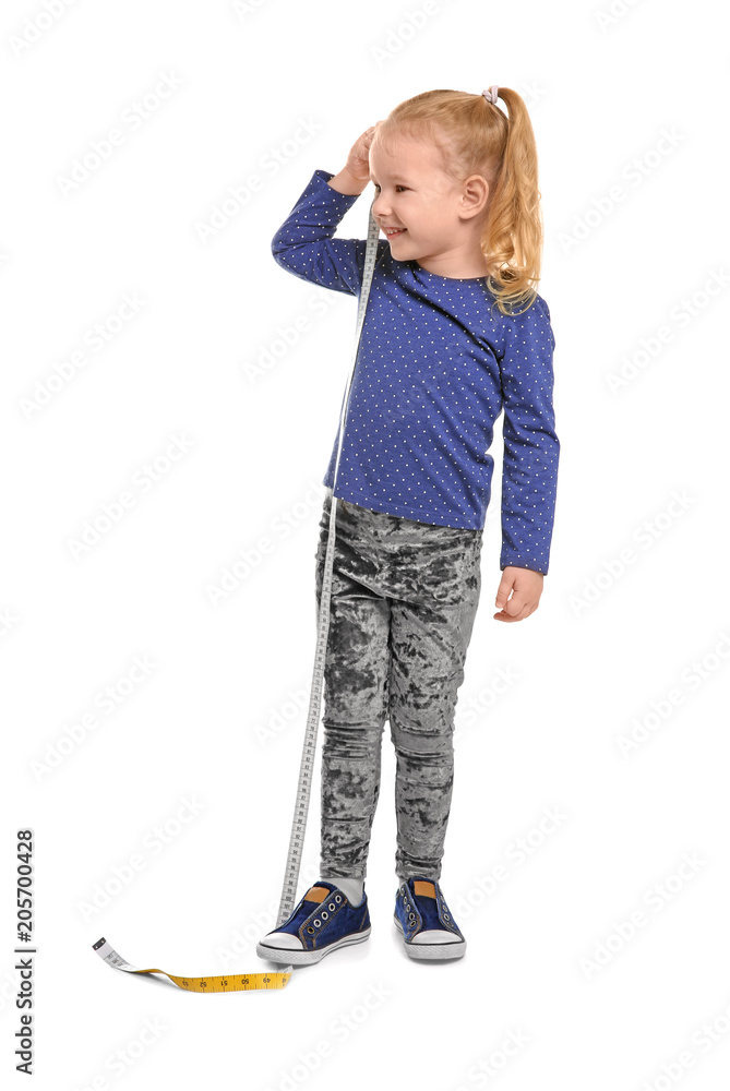 Little girl measuring her height on white background Little girl measuring her height on white background