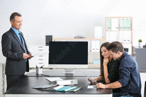 Young couple at notary publ...