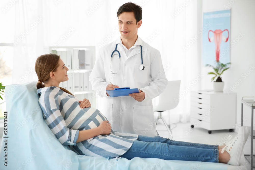 Gynecology consultation. Pregnant woman with her doctor in clinic