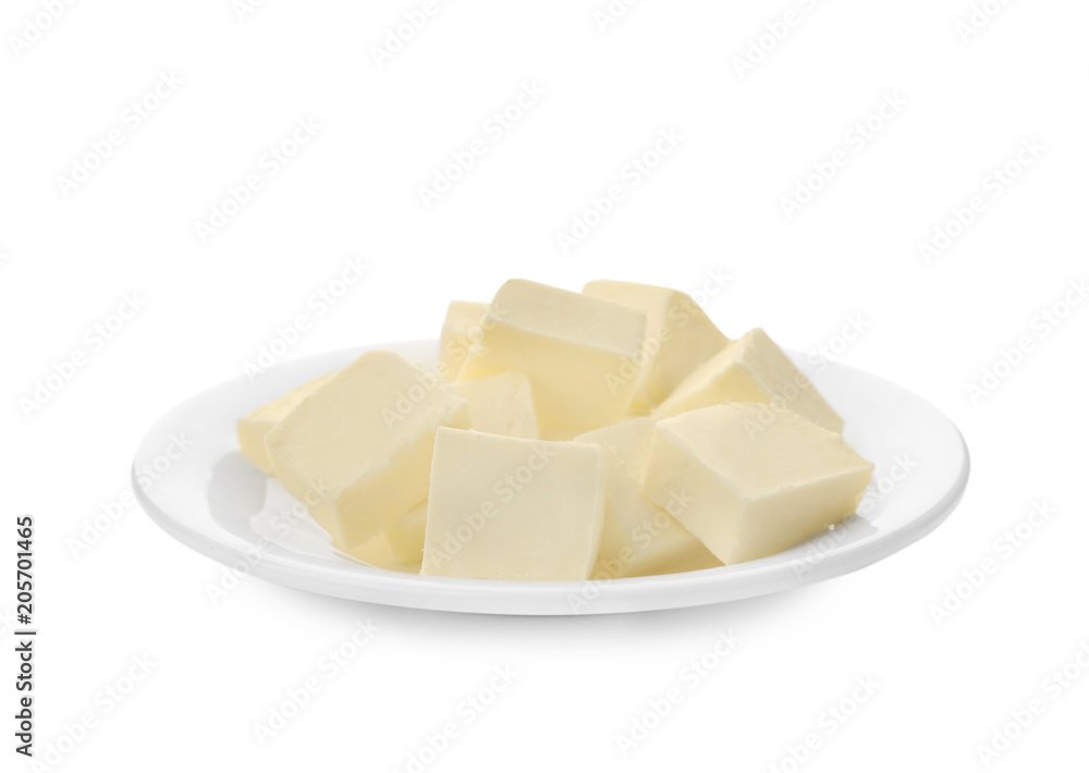 Plate with cubes of tasty fresh butter on white background