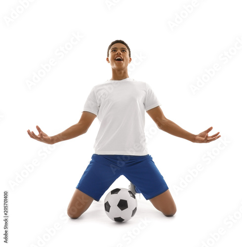 Fototapeta Naklejka Na Ścianę i Meble -  Teenage African-American football player on white background