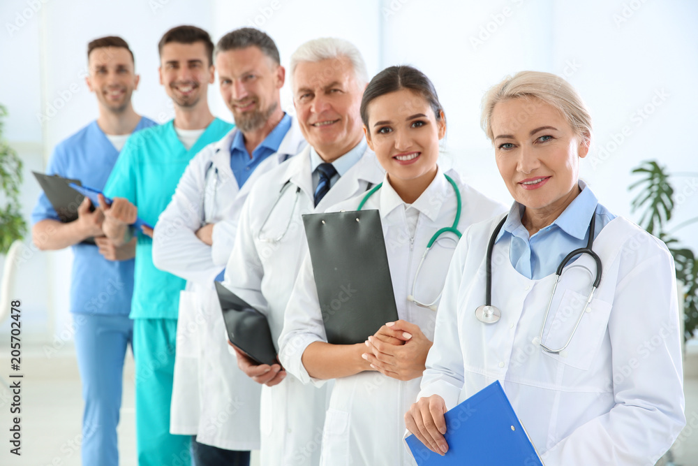 Group of doctors in uniform at clinic. Cardiology conference Group of doctors in uniform at clinic. Cardiology conference