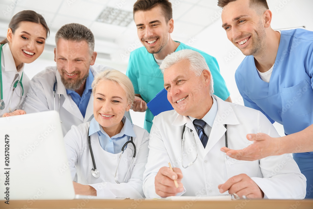 Fototapeta premium Group of doctors attending meeting in clinic. Cardiology conference