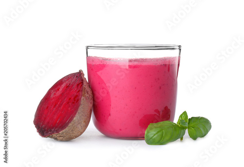 Glass with healthy detox smoothie and beet on white background