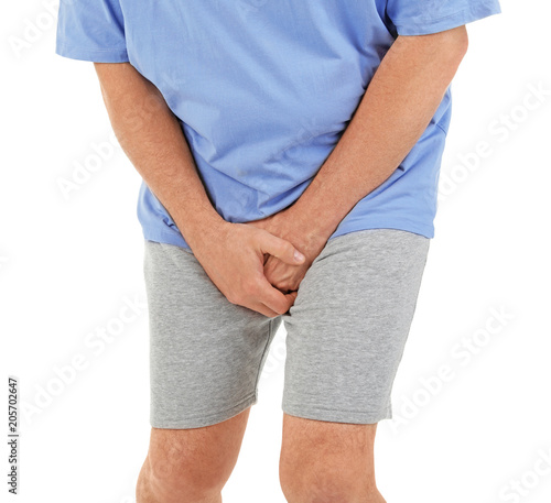 Mature man with urological problems suffering from pain on white background