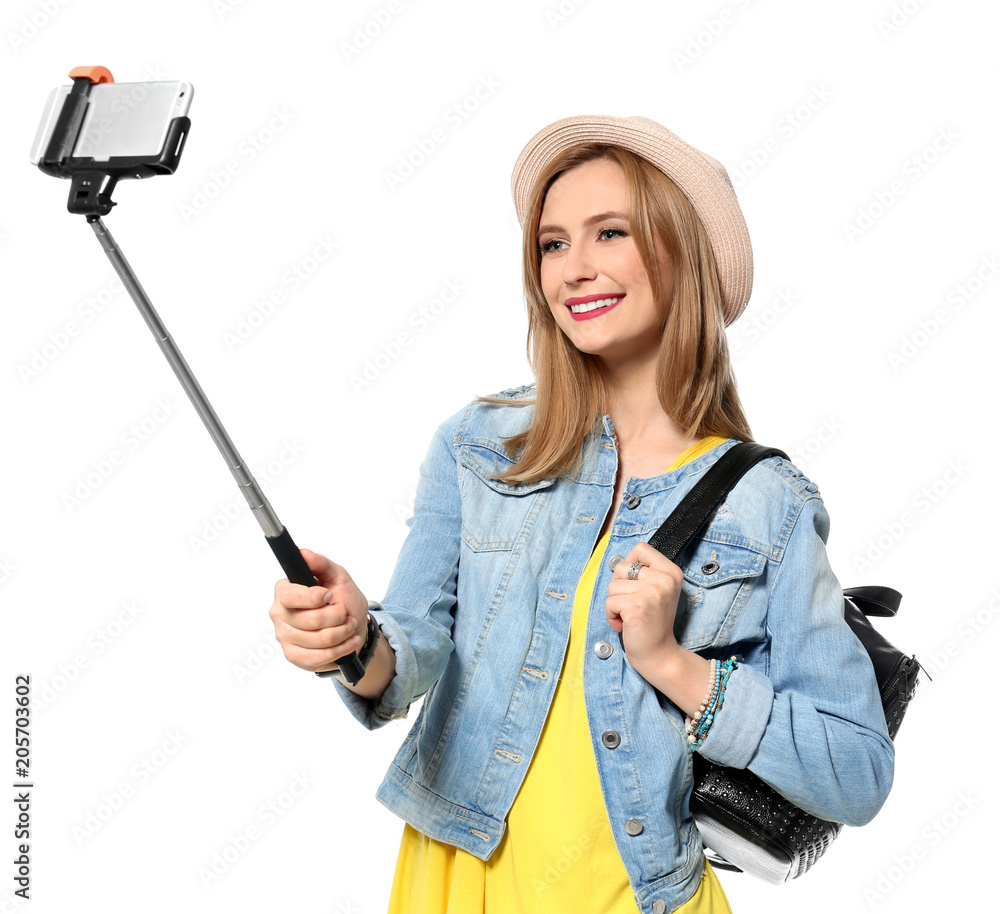 Attractive young woman taking selfie on white background Attractive young woman taking selfie on white background