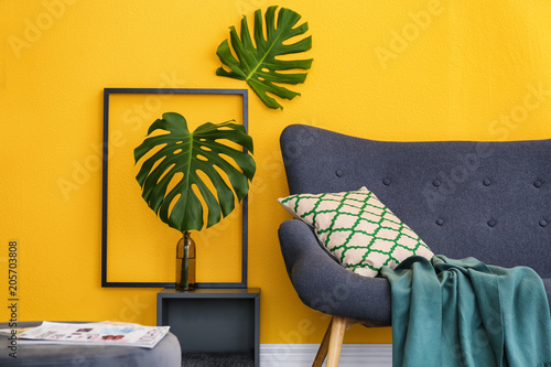 Elegant living room interior with comfortable sofa. Home design in rainbow colors photo