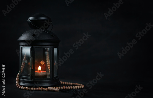 Ramadan Candle Lantern with Wooden Prayer Beads Room For Text photo