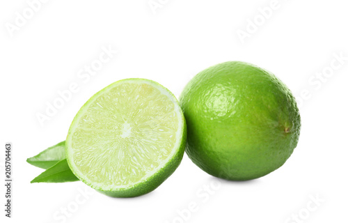 Fresh ripe green limes on white background