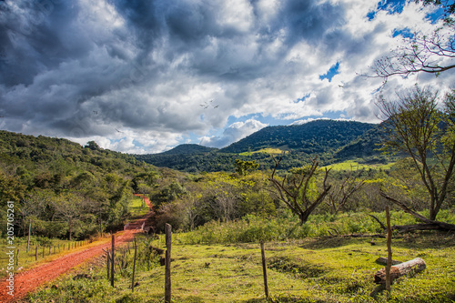Typical red sand path in Paraguay: here, from the Colonia Independencia to the Ybytyruzu mountains. photo