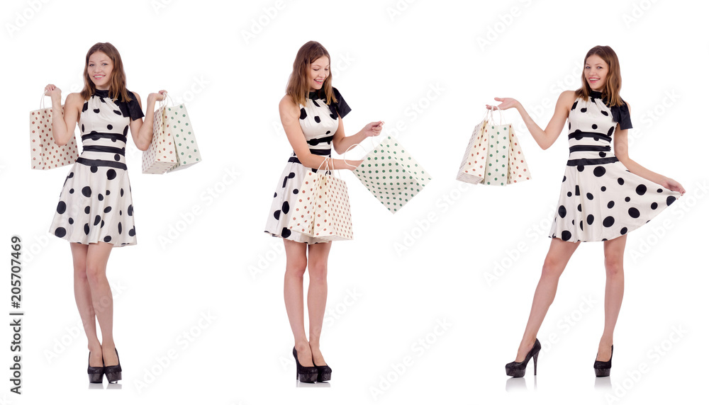 Young woman with shopping bags on white