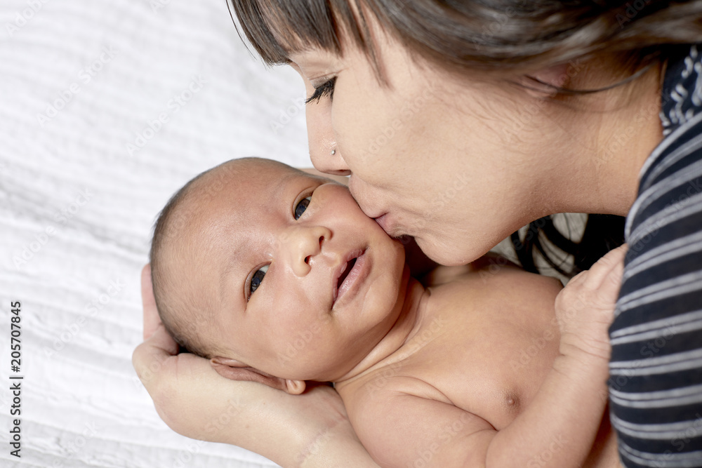 Mother cradling her Infant Mother cradling her Infant