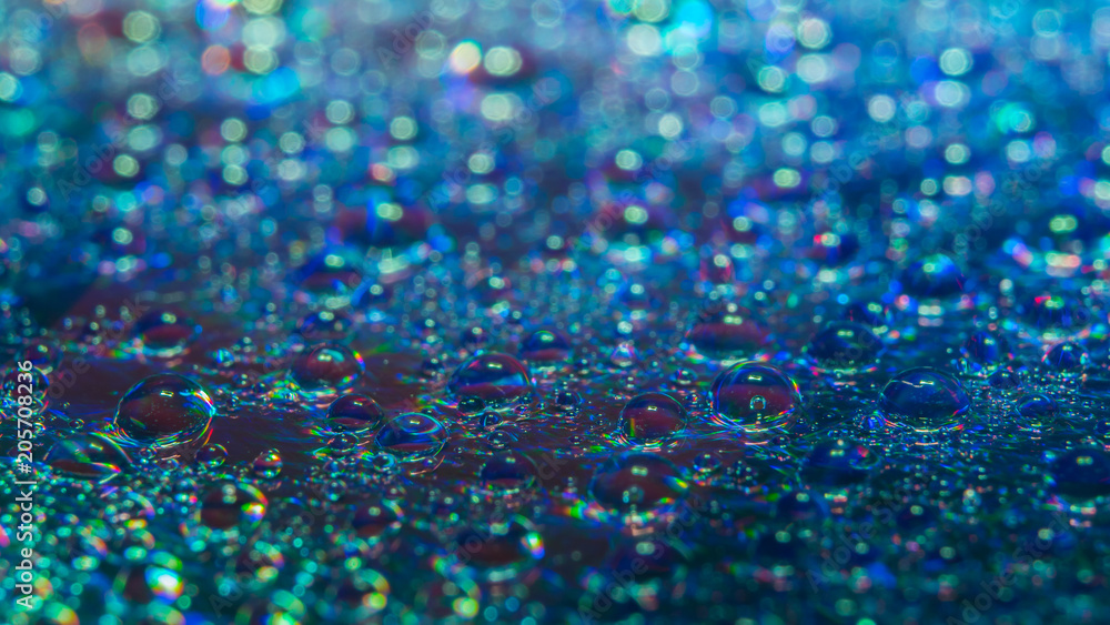 Water drops on the DVD, abstract view, selective focus, low light, underexposed, blur. Best for wallpaper and background use. Water drops on the DVD, abstract view, selective focus, low light, underexposed, blur. Best for wallpaper and background use.