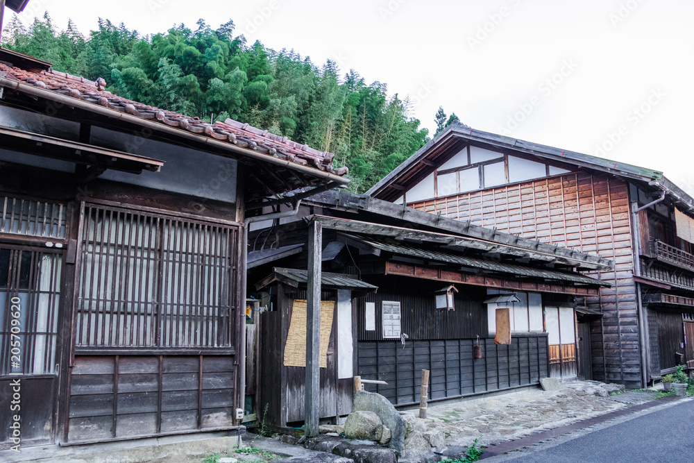 Kiso valley is the old  town or Japanese traditional wooden buildings for the travelers walking at historic old street  in Narai-juku , Nagano Prefecture, JAPAN.