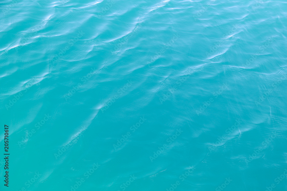 Clear blue sea water surface in sunny day of summer.