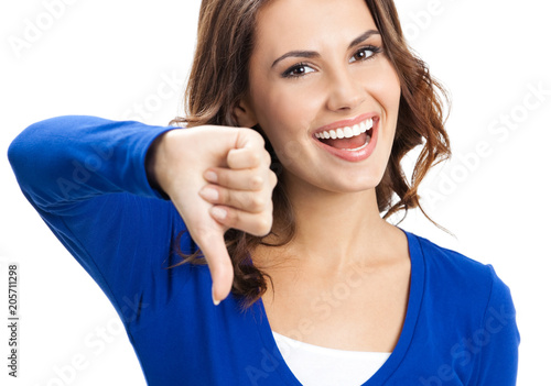 Woman showing thumbs down gesture, isolated photo